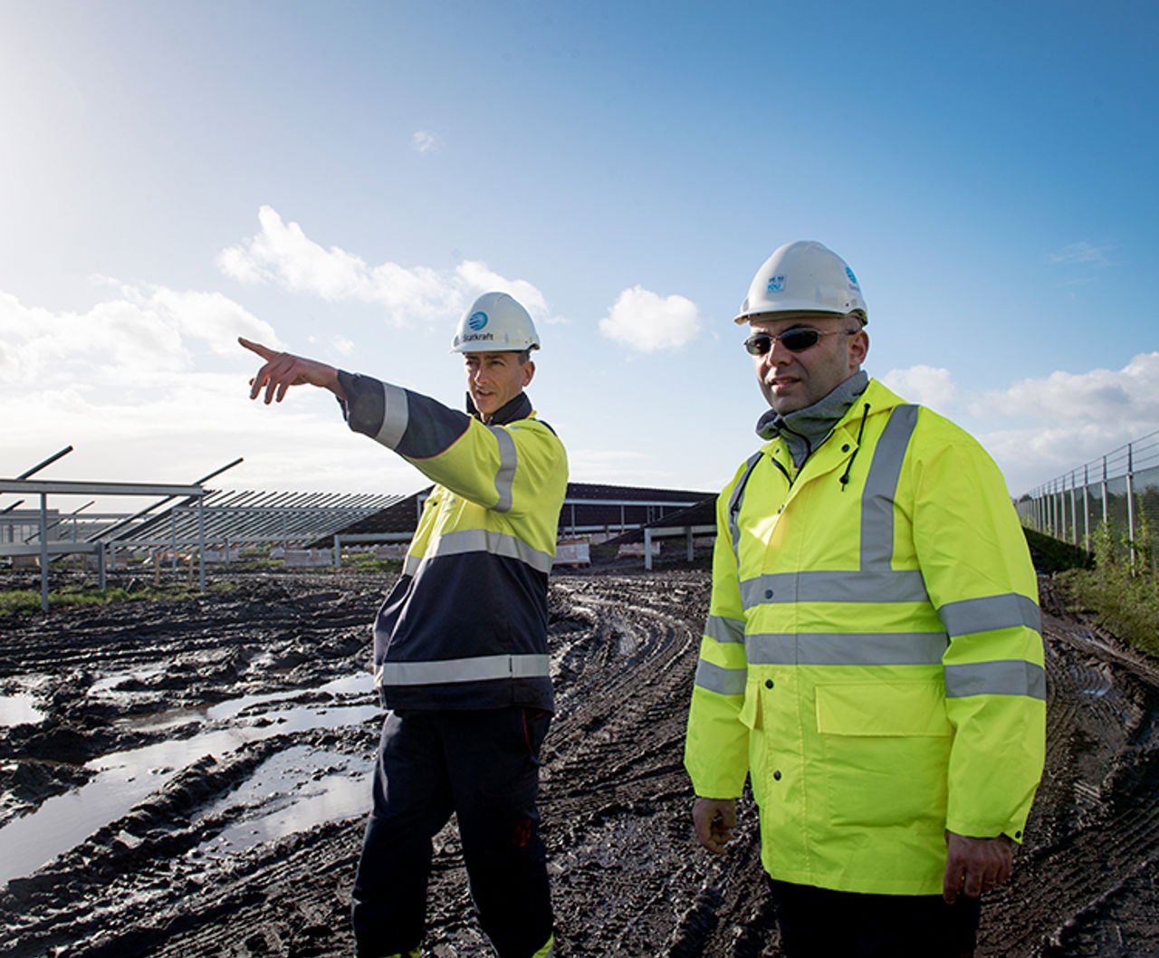Worker in front of solar plant